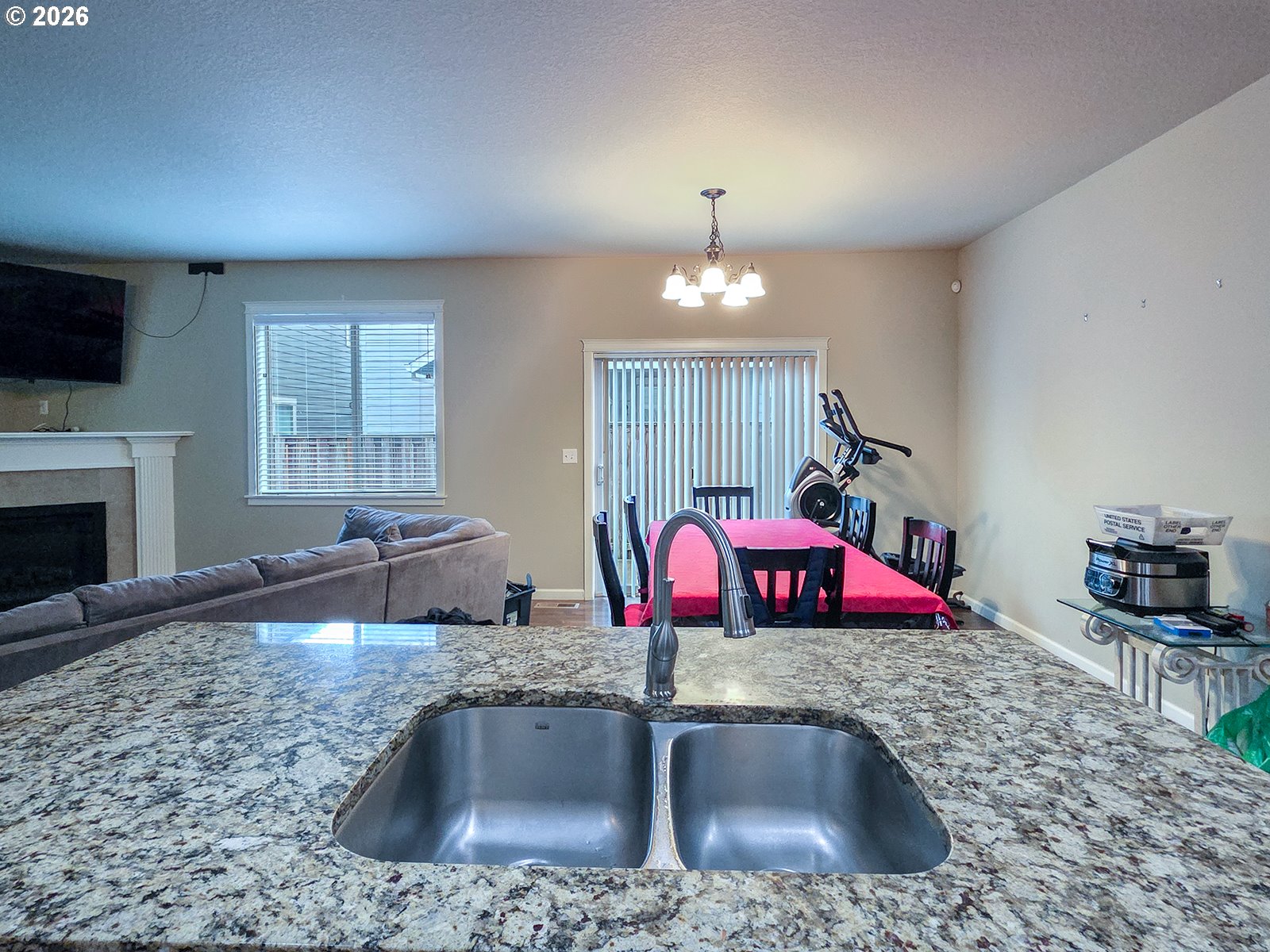 2838 26th Avenue Forest Grove, OR 97116 - Photo 10 of 37 a kitchen with kitchen island granite countertop a sink a counter space appliances and cabinets