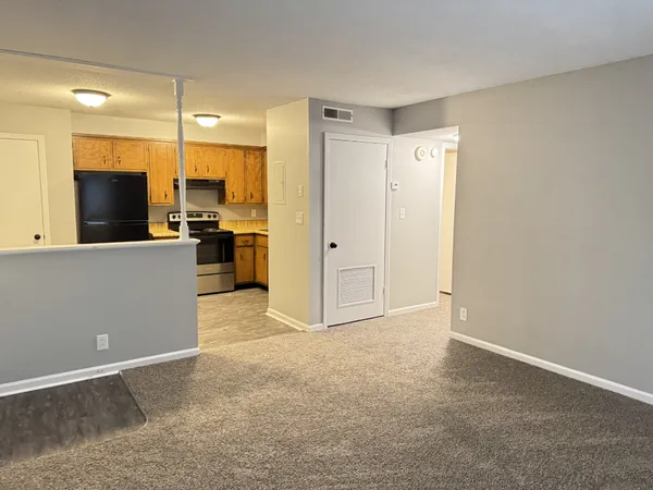 a kitchen with stainless steel appliances granite countertop a refrigerator stove and sink