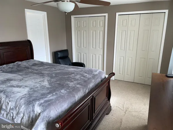 a living room with a bed and furniture
