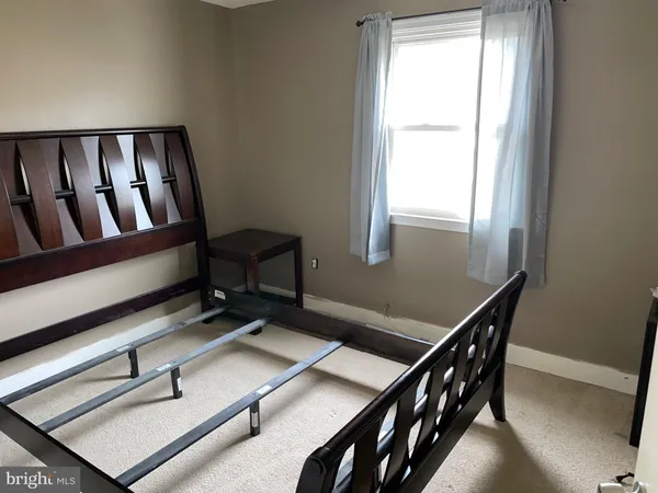 a room with gym equipment on wooden floor