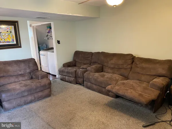 a living room with couches and a couch
