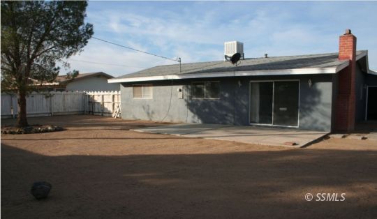404 Karin Street Ridgecrest, CA 93555 - Photo 9 of 10 a front view of a house with a garage