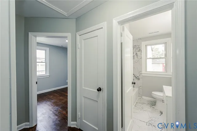 a view of room with window and hardwood floor