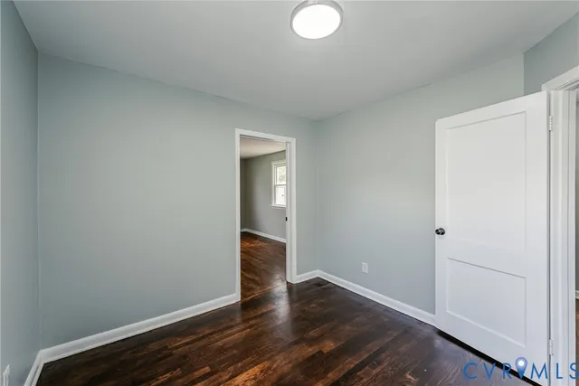 a view of room with wooden floor