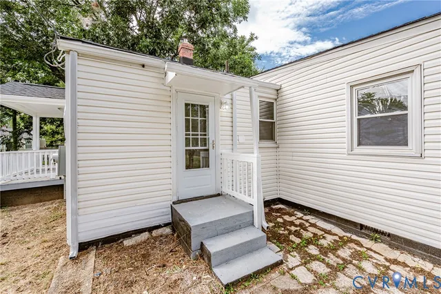 a view of a white house with a balcony