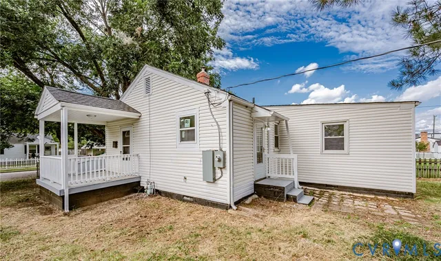 a view of a wooden house with a yard