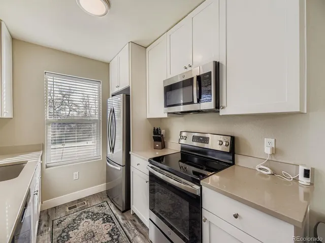 a kitchen with a stove and a microwave
