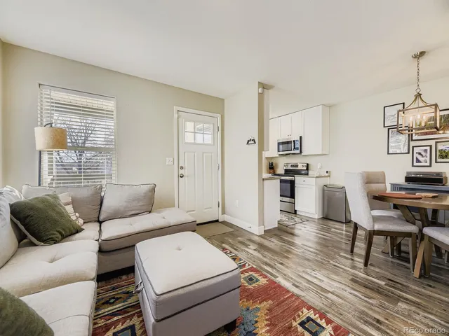 a living room with furniture and a table