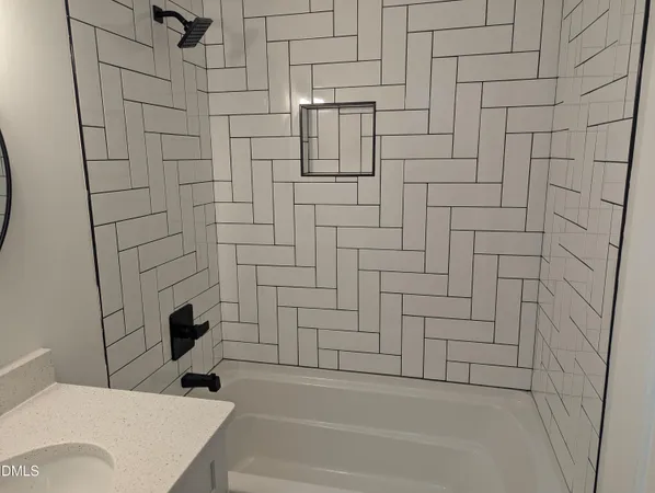 a bathroom with a toilet and a bathtub
