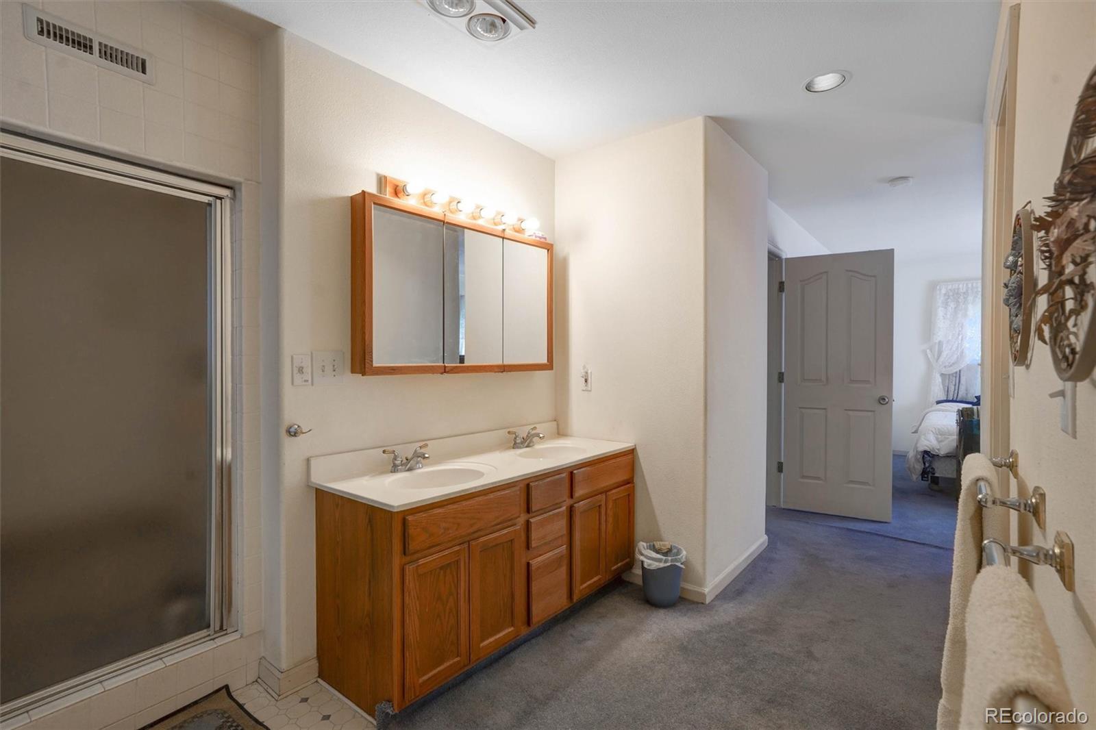 1206 Biddle Street Georgetown, CO 80444 - Photo 23 of 32 a bathroom with a sink and a mirror