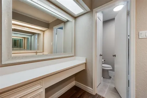 a bathroom with a toilet and a sink