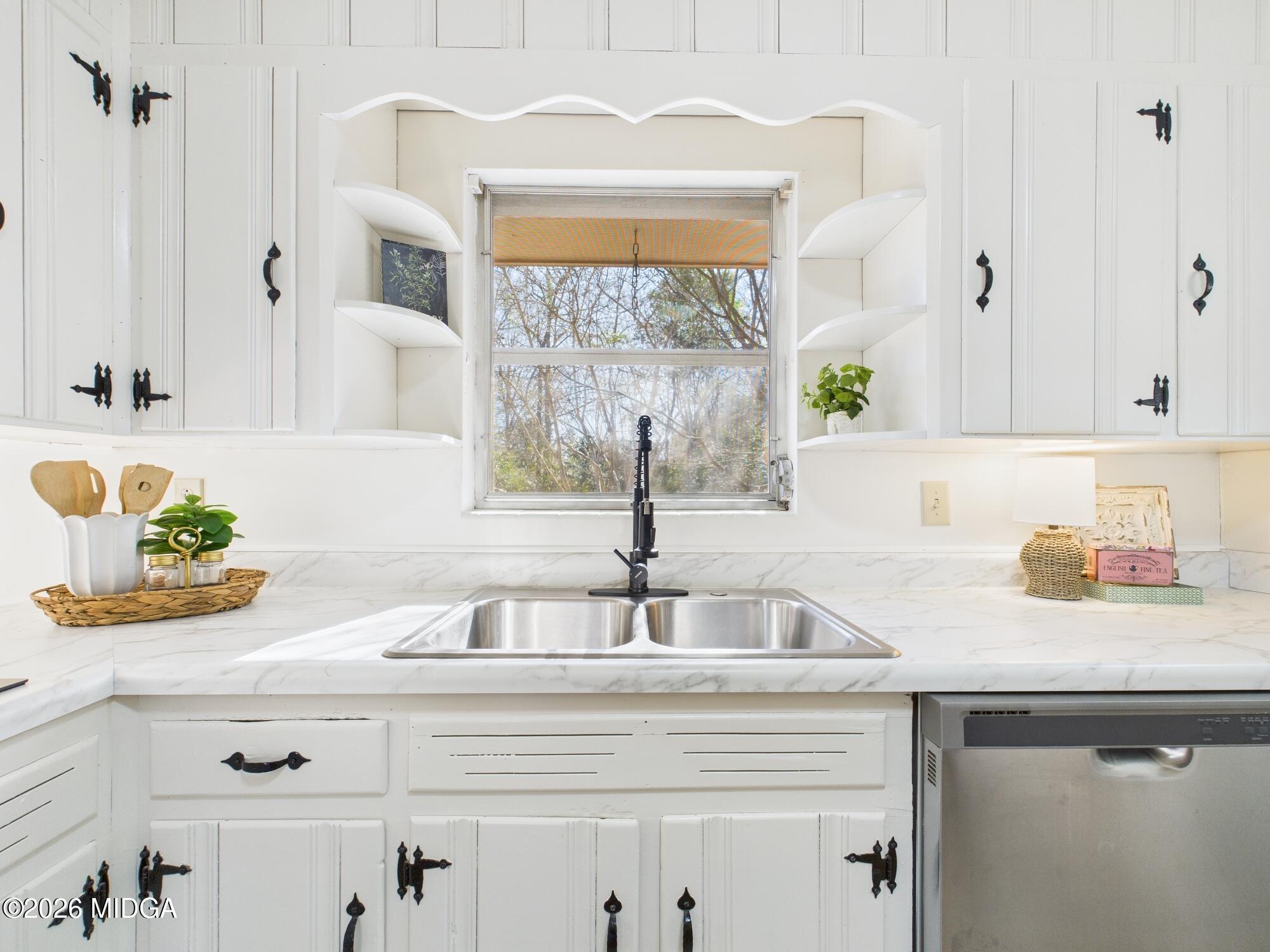 1432 Duncan Avenue Perry, GA 31069 - Photo 19 of 46 a kitchen with a sink and a window