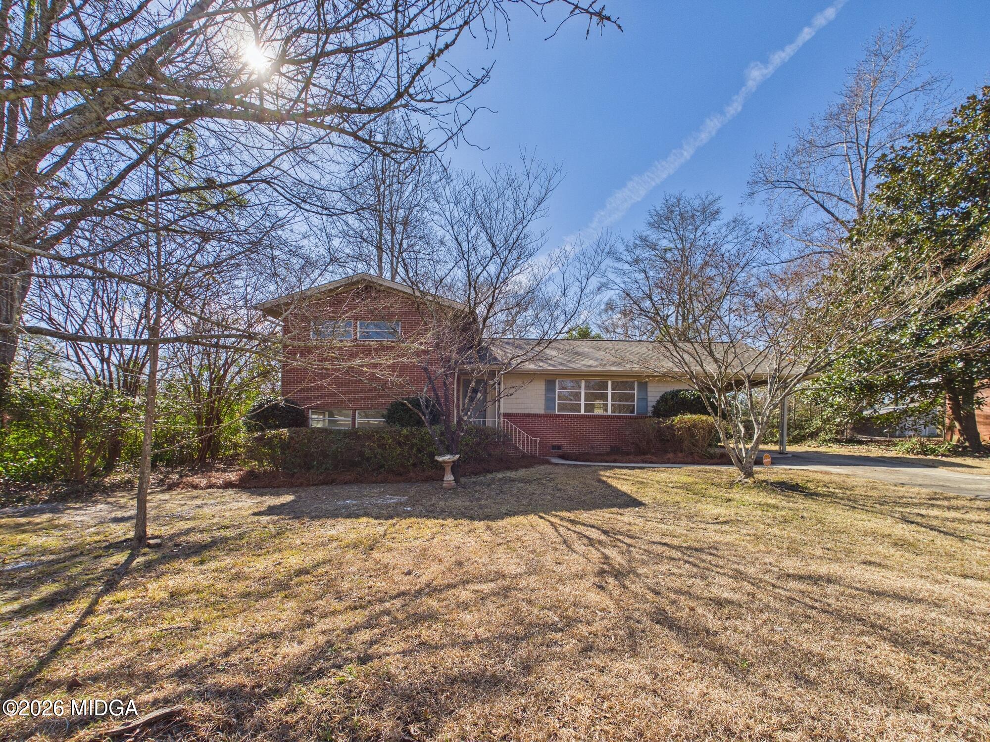 1432 Duncan Avenue Perry, GA 31069 - Photo 2 of 46 a view of a yard with a large tree