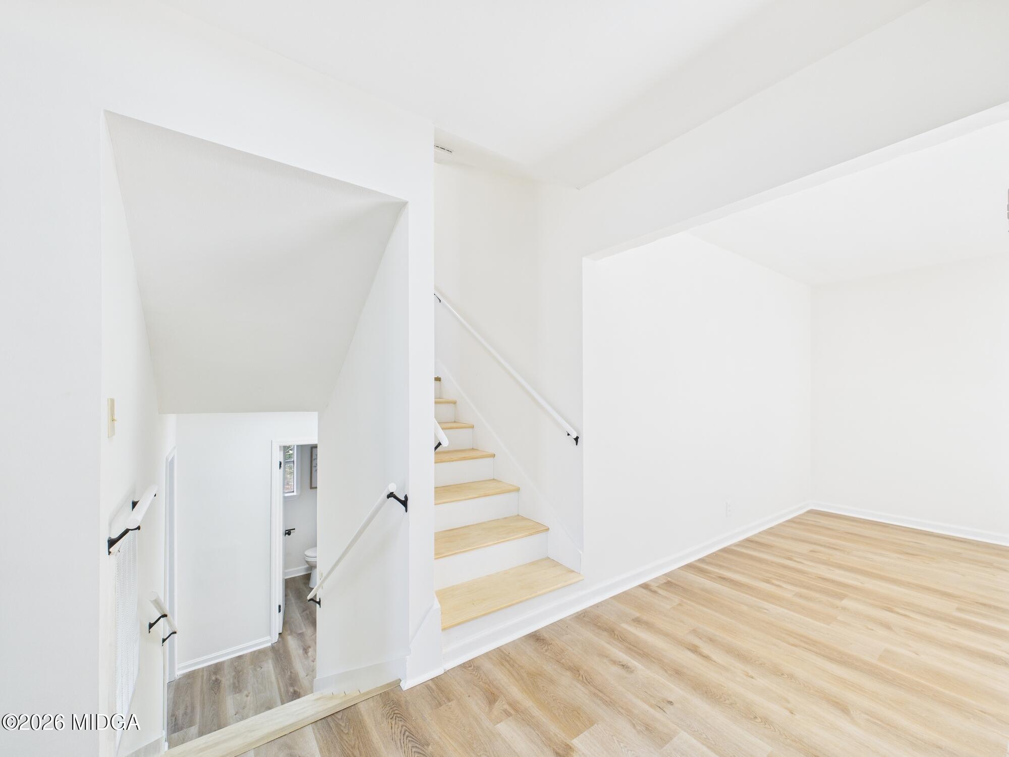 1432 Duncan Avenue Perry, GA 31069 - Photo 22 of 46 a view of a bedroom with wooden floor and entryway