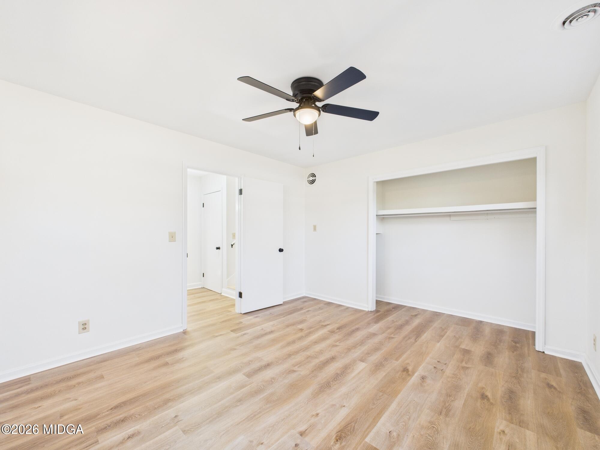 1432 Duncan Avenue Perry, GA 31069 - Photo 25 of 46 a view of a big room with wooden floor and windows in a room