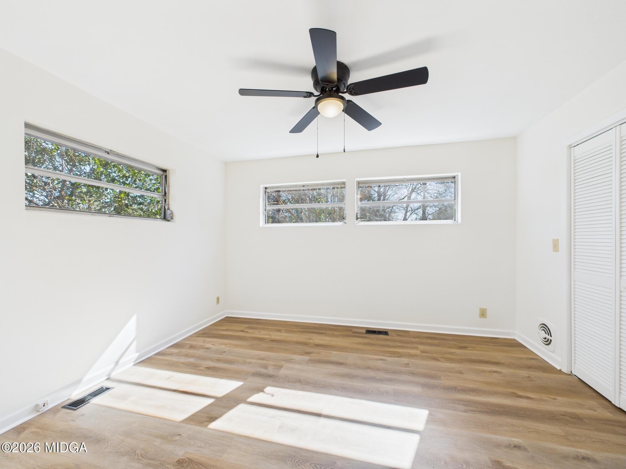 1432 Duncan Avenue Perry, GA 31069 - Photo 30 of 46 a view of a room with wooden floor and window