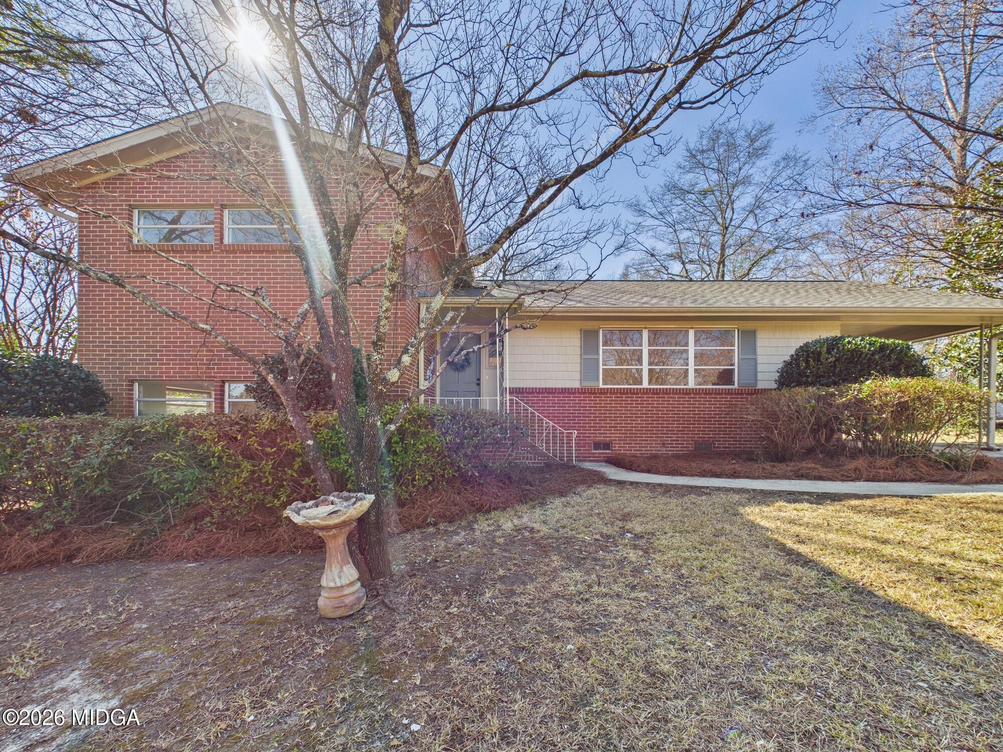 1432 Duncan Avenue Perry, GA 31069 - Photo 3 of 46 a view of a house with backyard and a tree