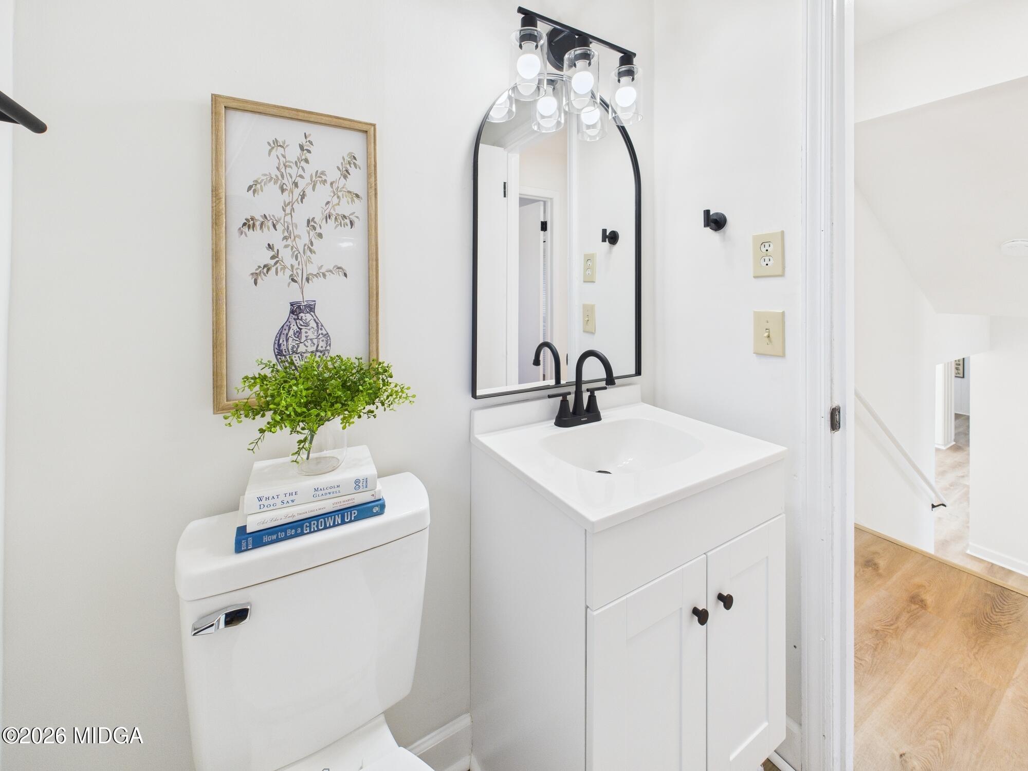 1432 Duncan Avenue Perry, GA 31069 - Photo 33 of 46 a bathroom with a sink mirror and vanity
