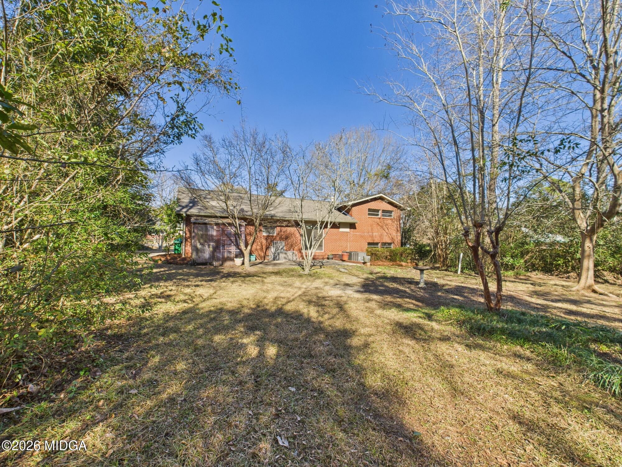1432 Duncan Avenue Perry, GA 31069 - Photo 37 of 46 a view of a yard with tree s