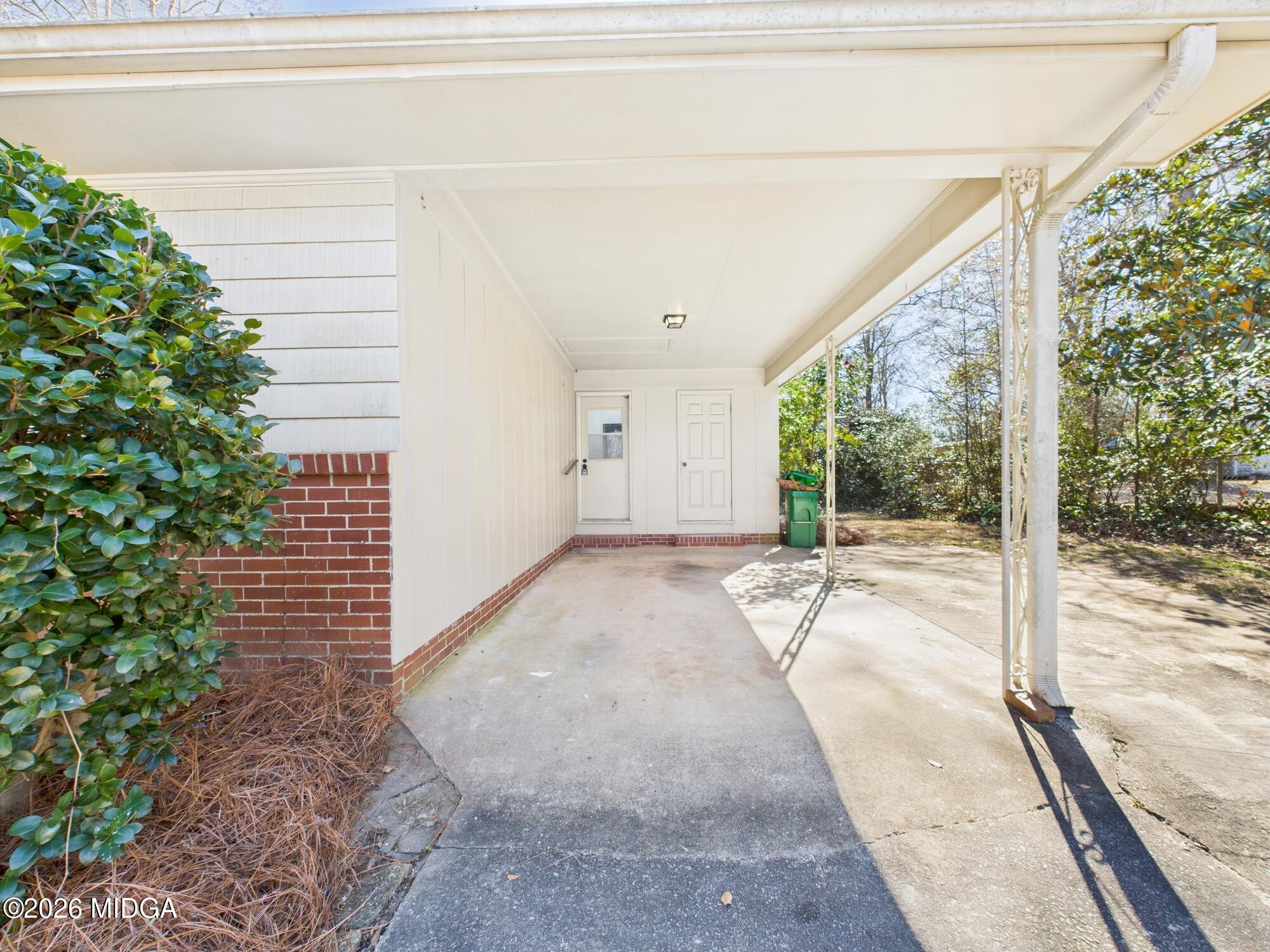 1432 Duncan Avenue Perry, GA 31069 - Photo 42 of 46 a view of a room with a large window and plants