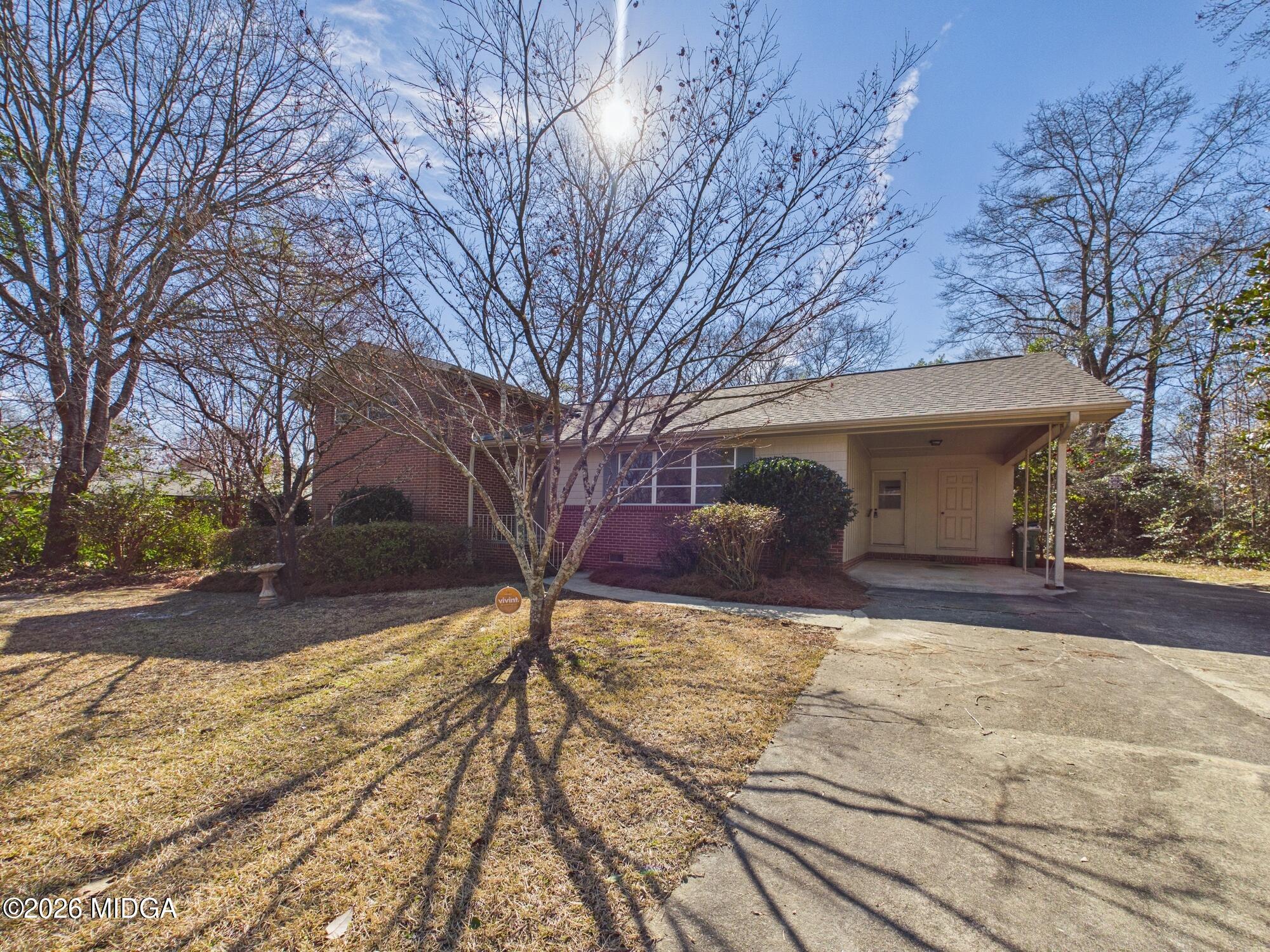 1432 Duncan Avenue Perry, GA 31069 - Photo 44 of 46 a view of a yard with a large tree