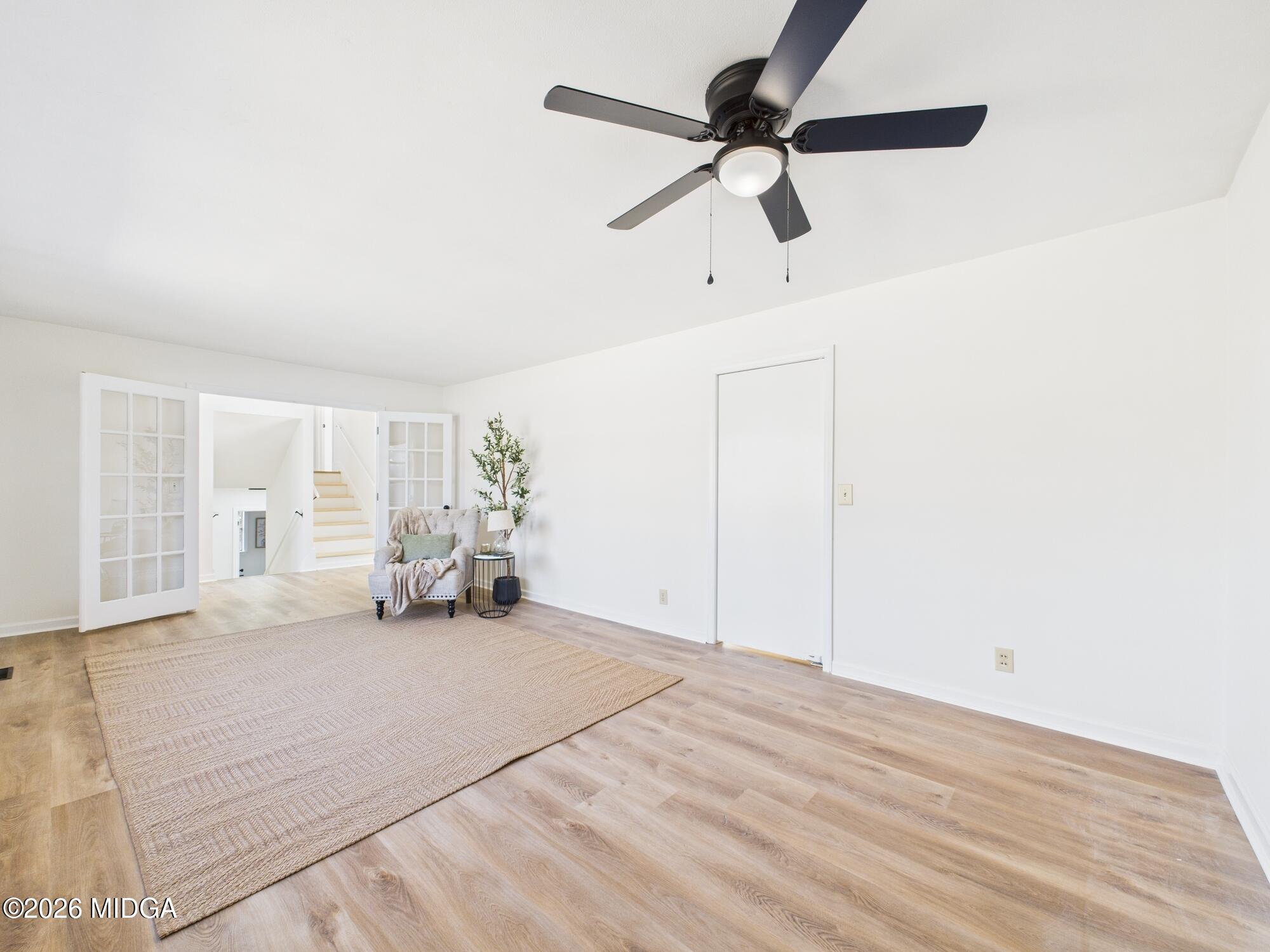 1432 Duncan Avenue Perry, GA 31069 - Photo 8 of 46 a view of a livingroom with a furniture and a ceiling fan