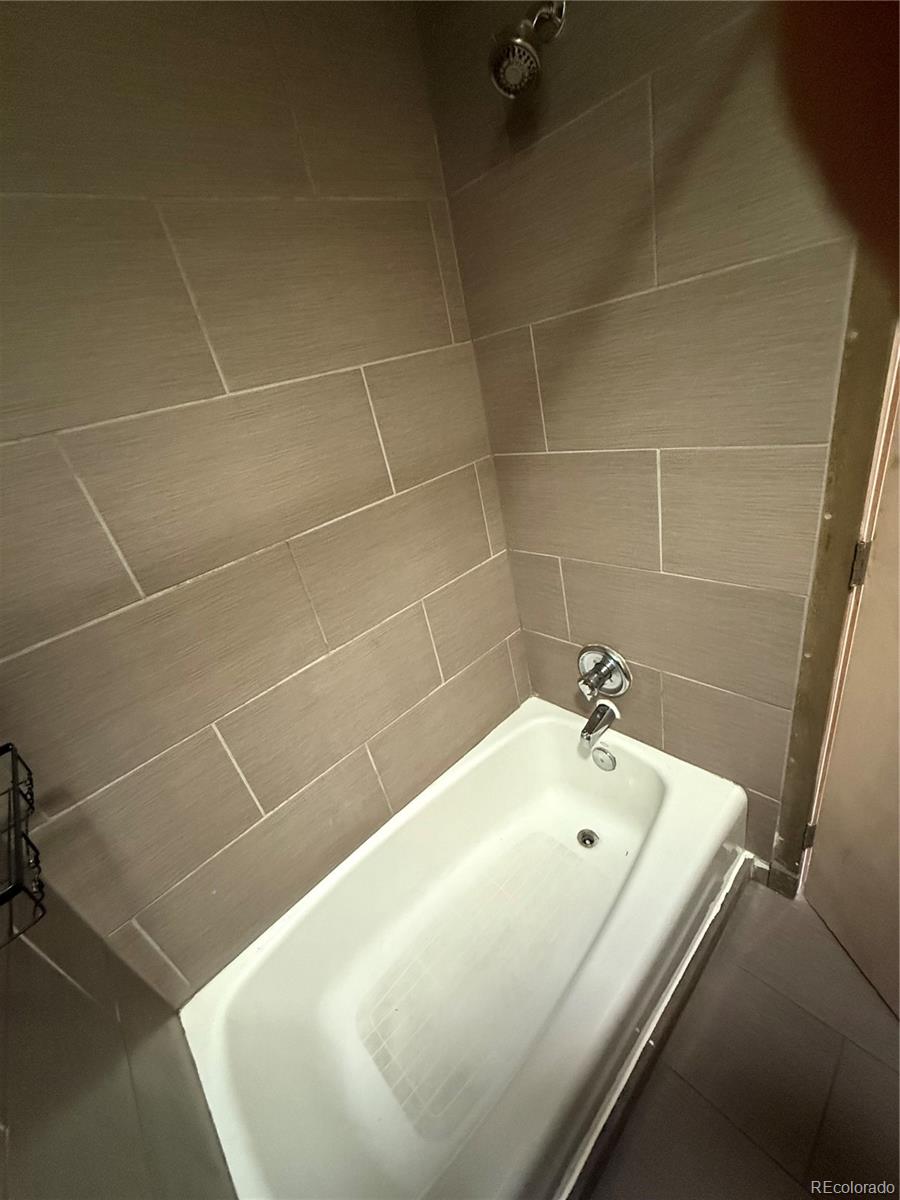 1131 21st Street Denver, CO 80205 - Photo 9 of 15 a bathroom with a bathtub