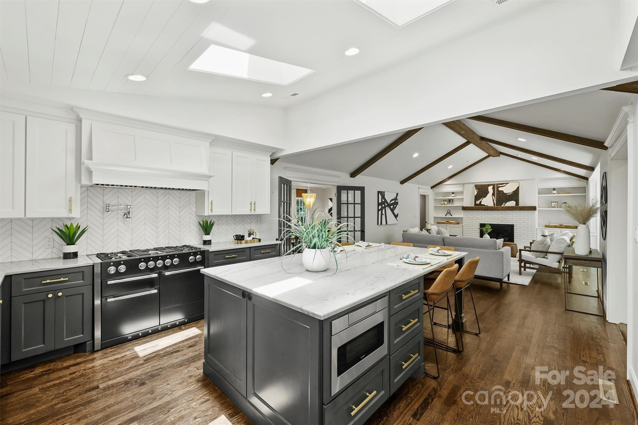207 Crescent Drive Davidson, NC 28036 - Photo 15 of 43 a open kitchen with stainless steel appliances granite countertop a stove and a refrigerator