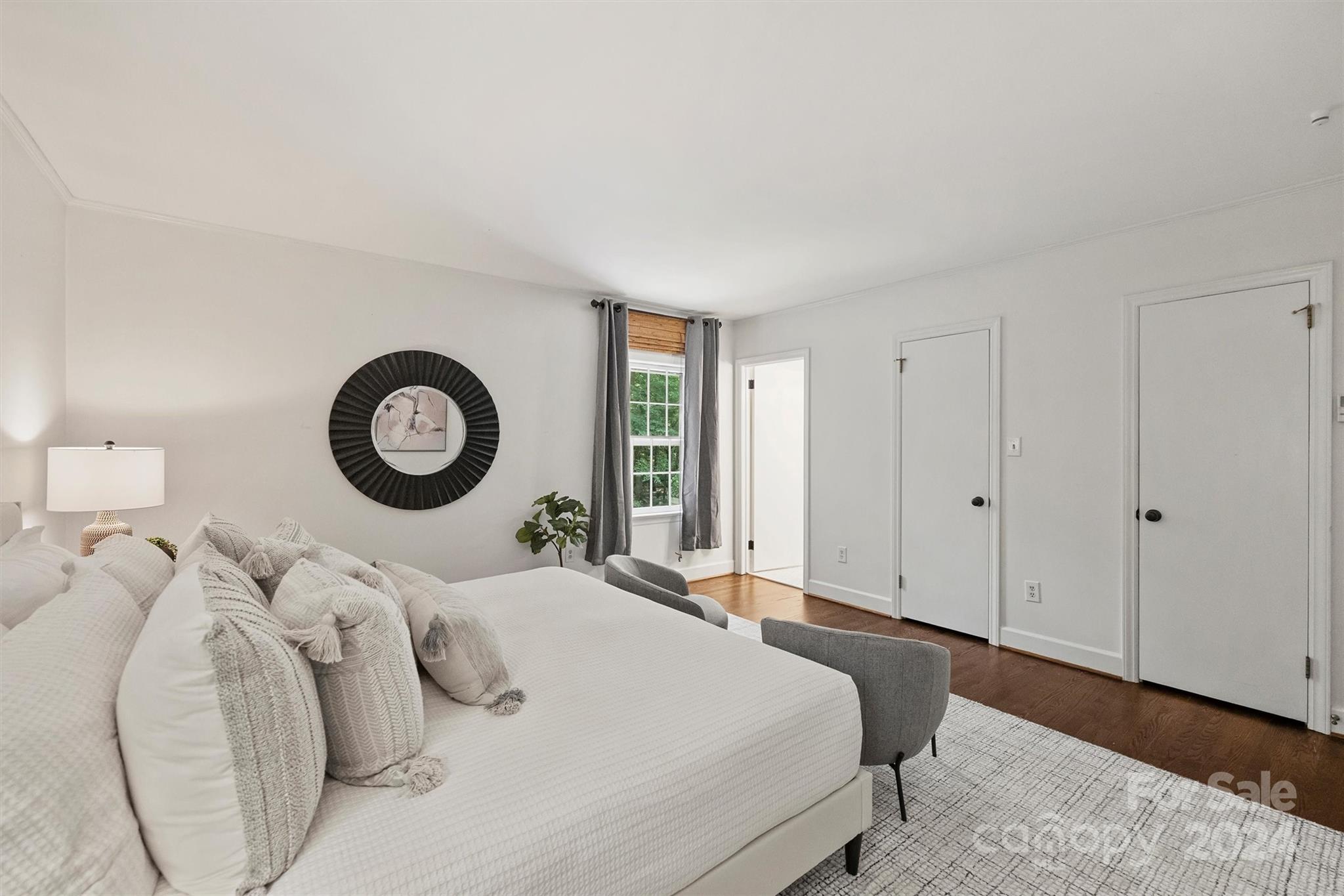 207 Crescent Drive Davidson, NC 28036 - Photo 28 of 43 a bedroom with a bed and a window