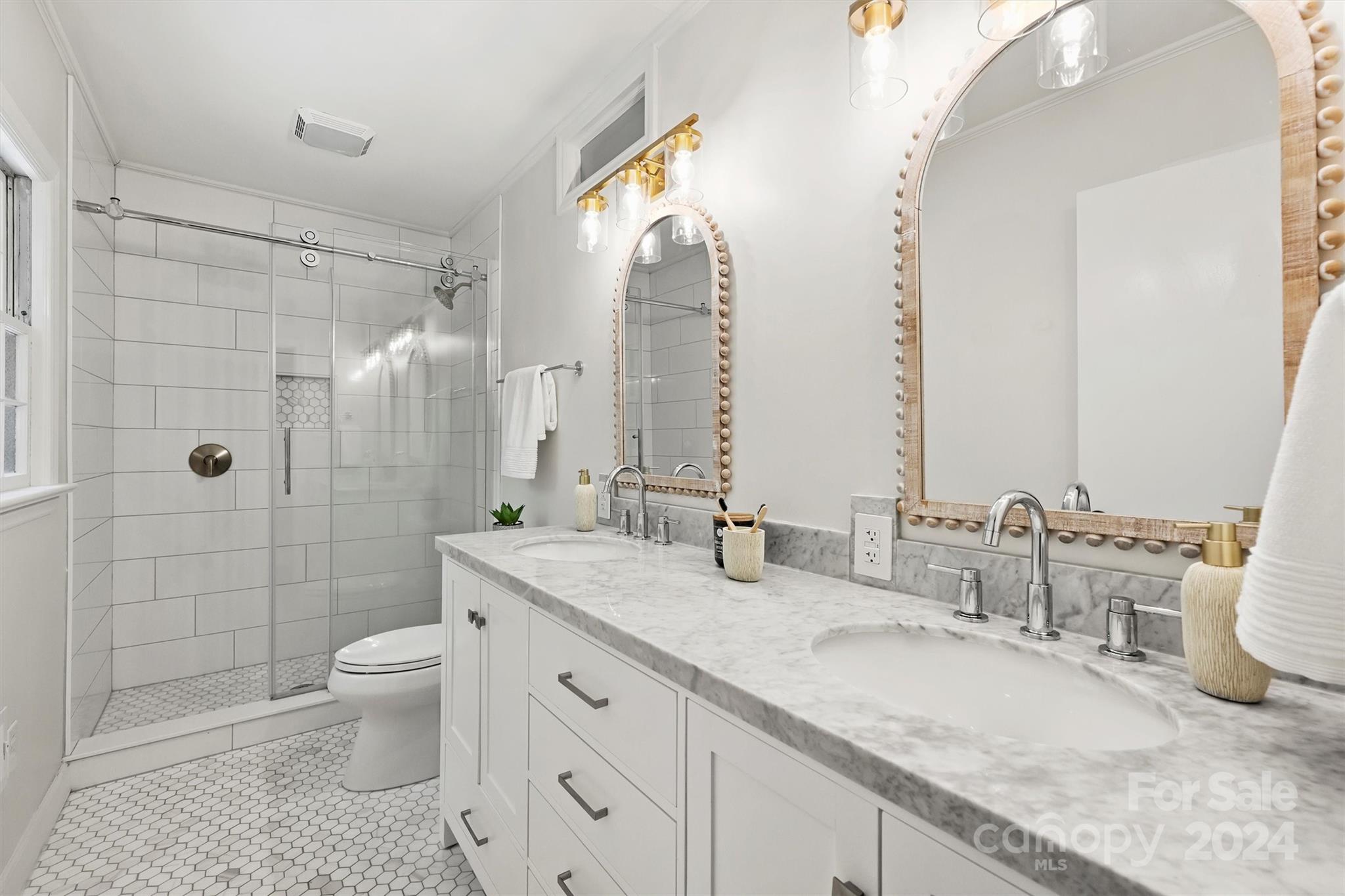 207 Crescent Drive Davidson, NC 28036 - Photo 29 of 43 a bathroom with a granite countertop double vanity sink toilet and shower
