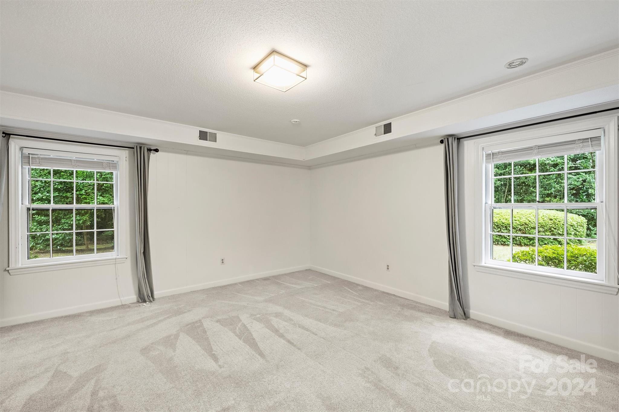 207 Crescent Drive Davidson, NC 28036 - Photo 34 of 43 an empty room with windows