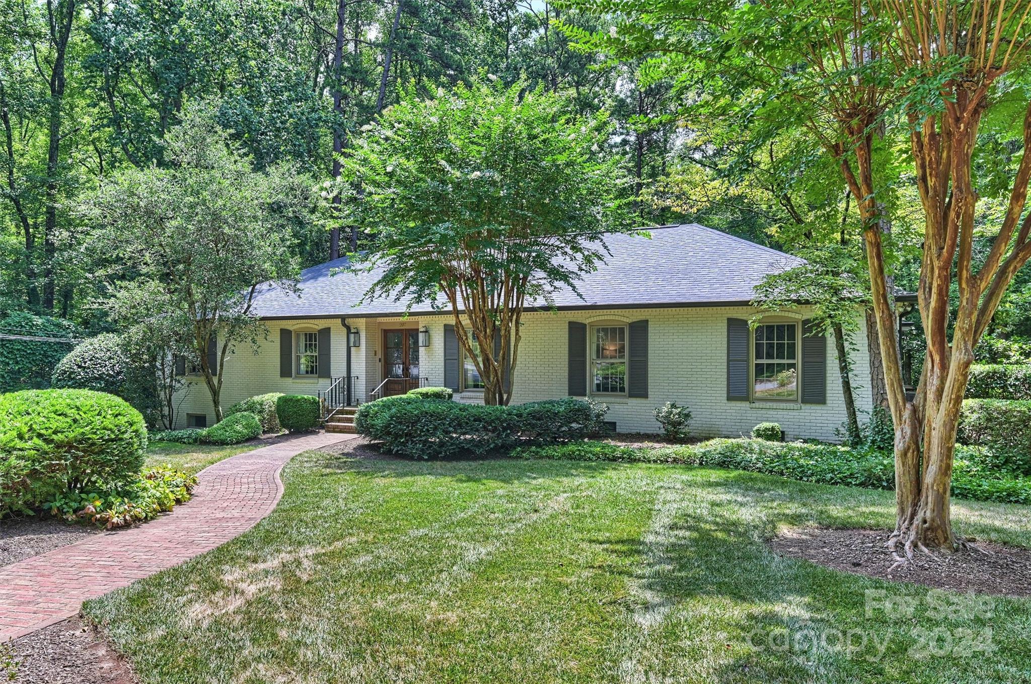 207 Crescent Drive Davidson, NC 28036 - Photo 43 of 43 a front view of a house with garden