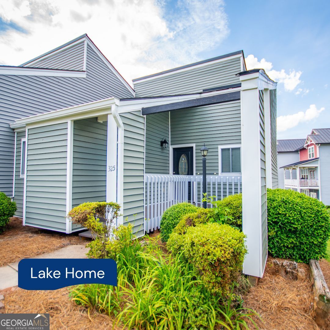 a view of a house with potted plants