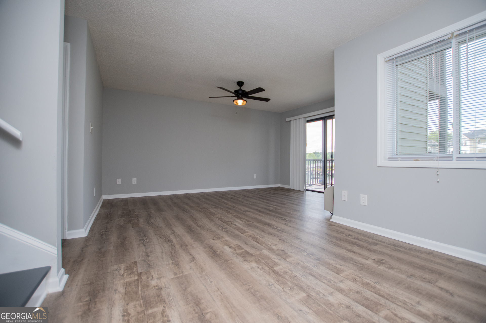 325 Berry Court Villa Rica, GA 30180 - Photo 13 of 43 wooden floor in an empty room with a window