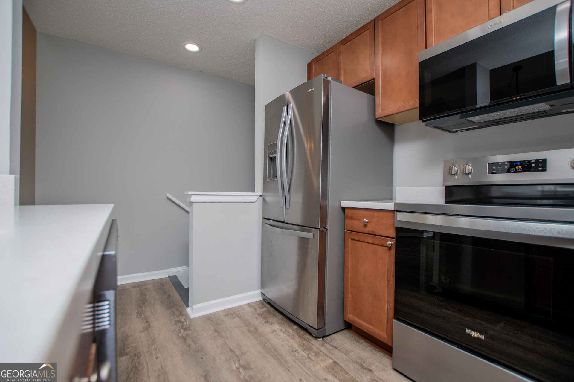 325 Berry Court Villa Rica, GA 30180 - Photo 16 of 43 a kitchen with a refrigerator stove and microwave