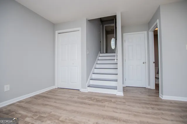 a view of entryway with wooden floor