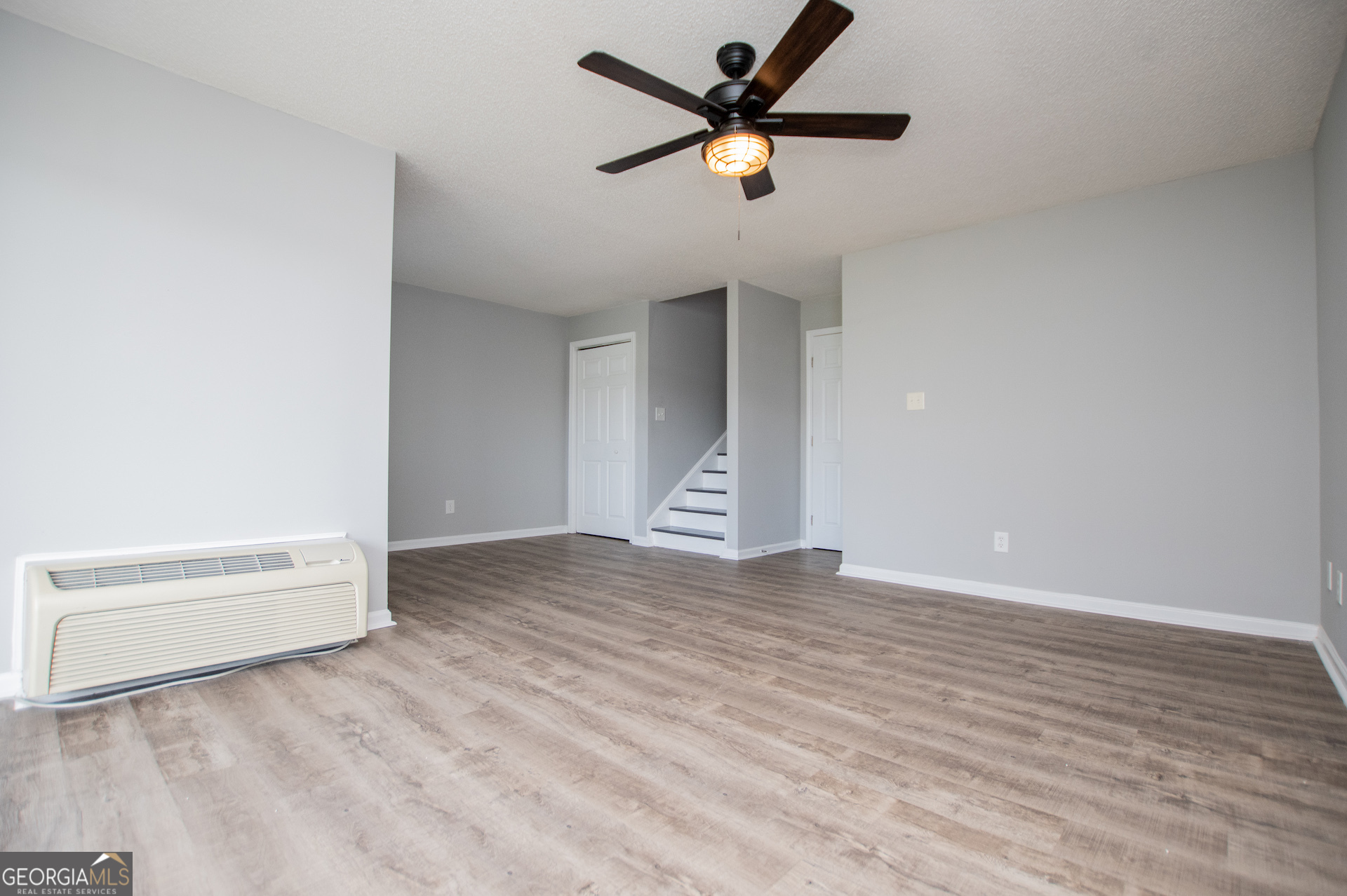 325 Berry Court Villa Rica, GA 30180 - Photo 20 of 43 a view of an empty room with wooden floor and a window