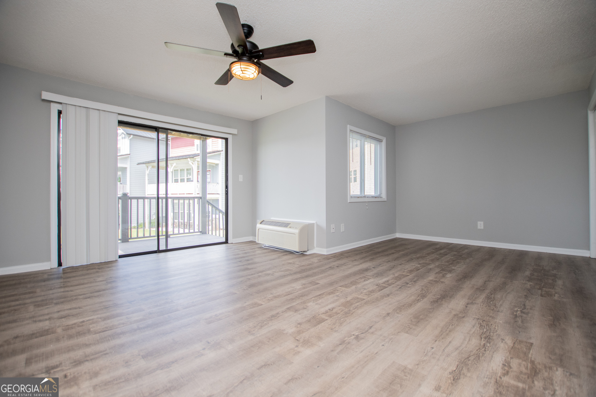 325 Berry Court Villa Rica, GA 30180 - Photo 21 of 43 a view of empty room with wooden floor and fan