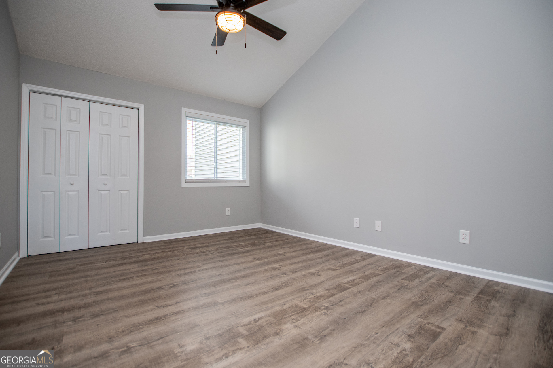 325 Berry Court Villa Rica, GA 30180 - Photo 23 of 43 wooden floor in an empty room with a window