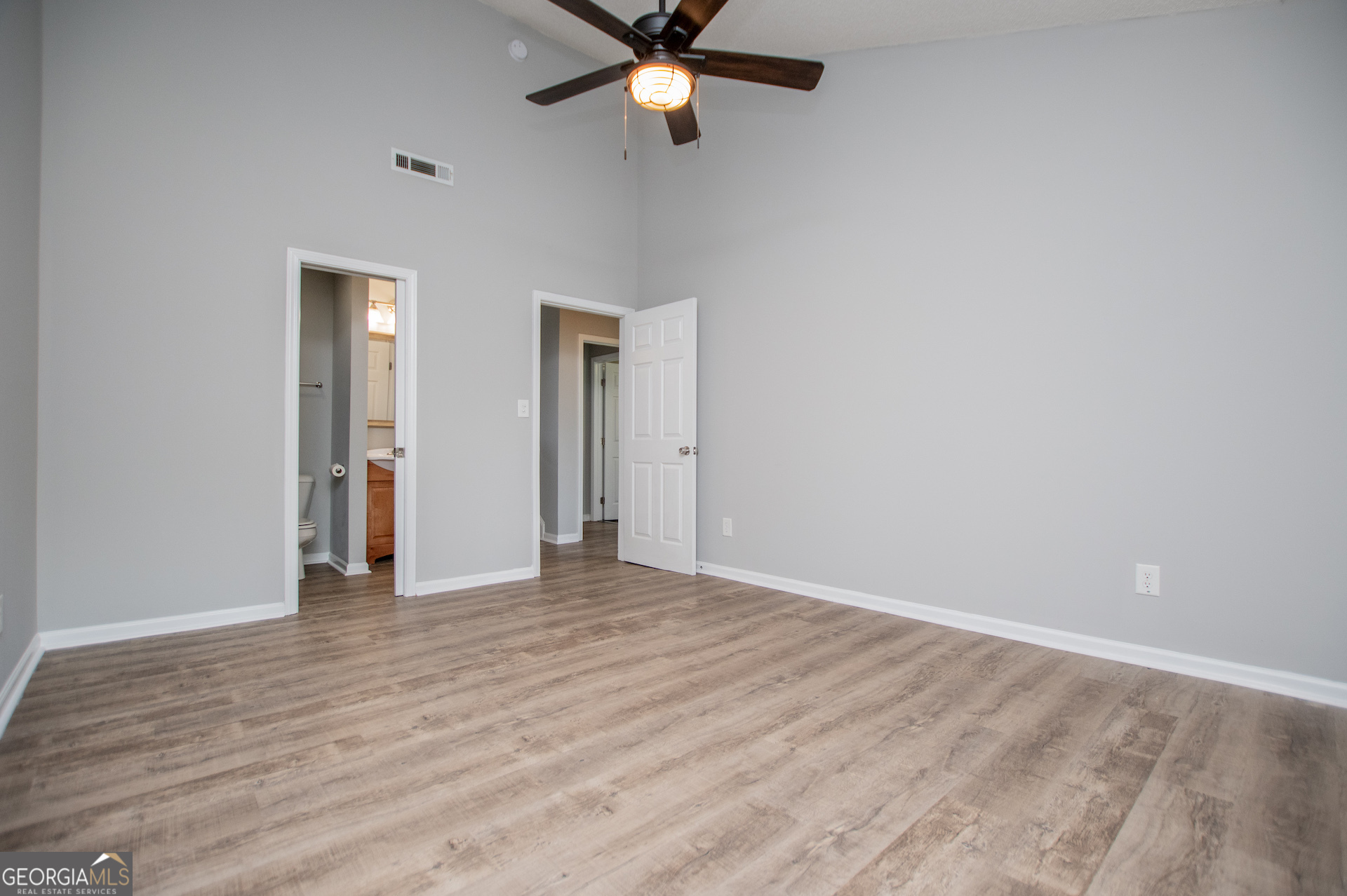 325 Berry Court Villa Rica, GA 30180 - Photo 24 of 43 a view of an empty room with wooden floor