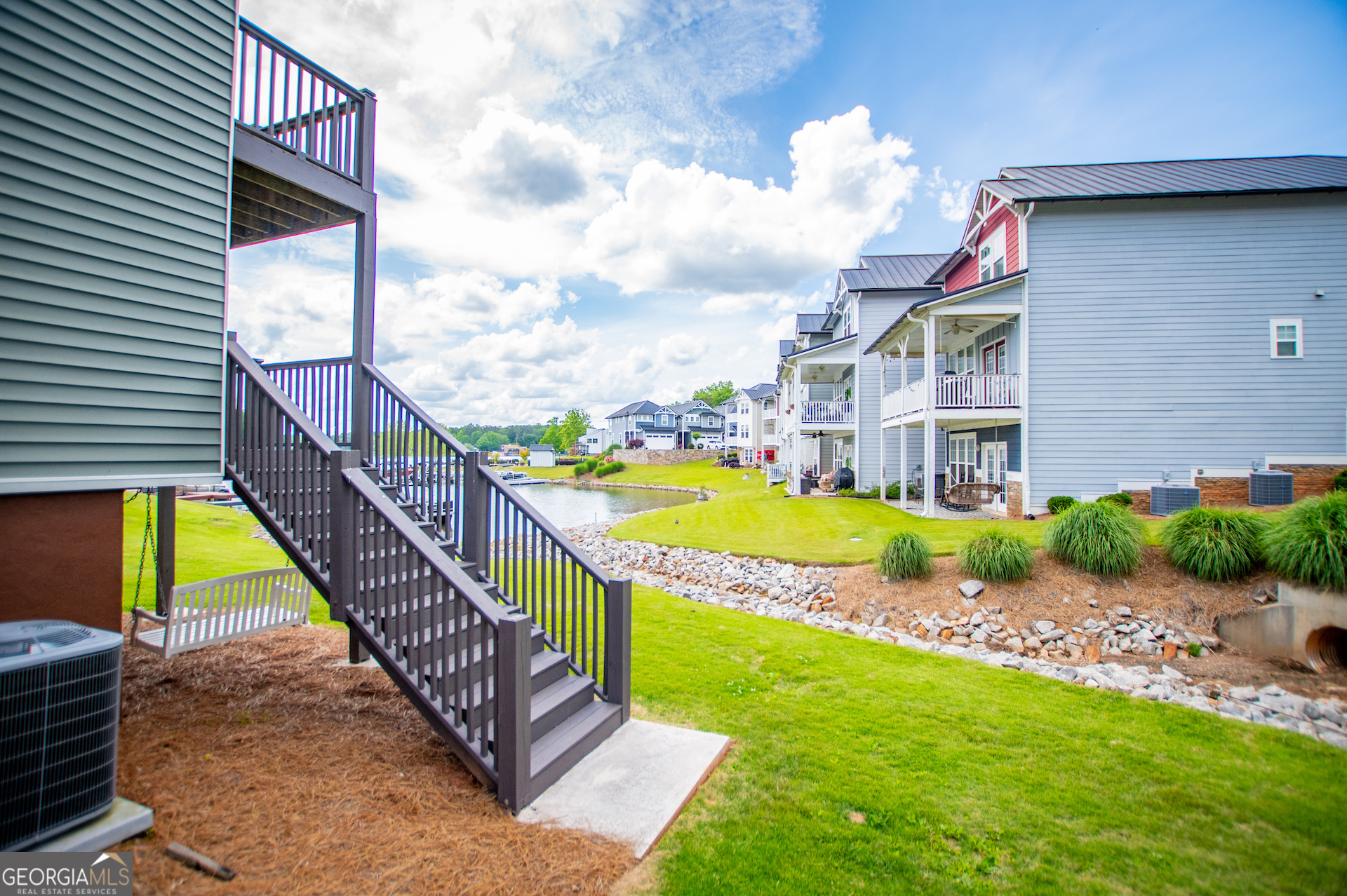 325 Berry Court Villa Rica, GA 30180 - Photo 31 of 43 a view of a swimming pool with a lounge chairs