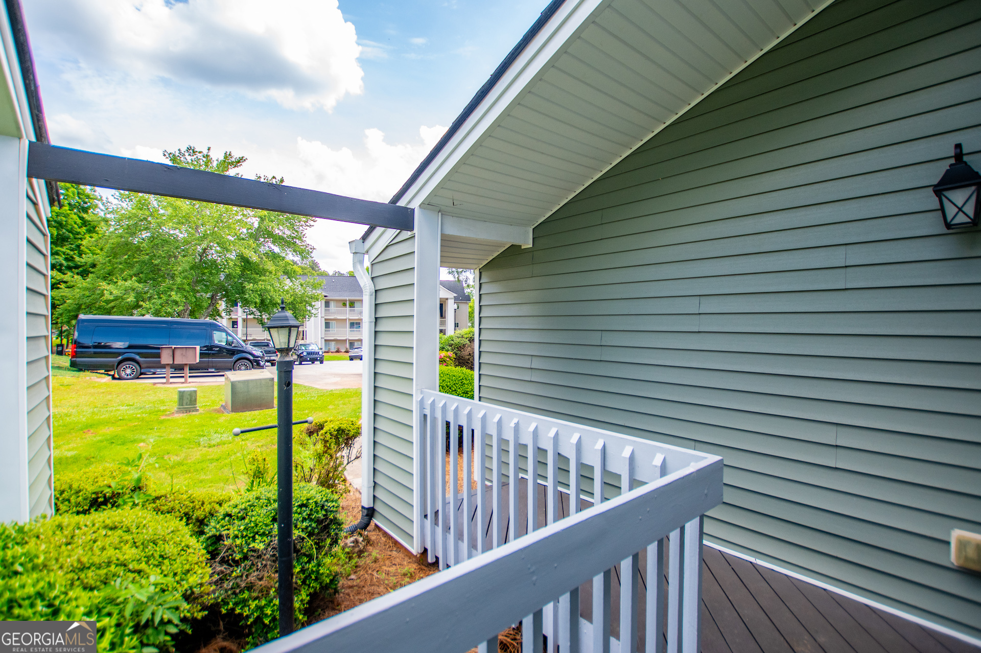 325 Berry Court Villa Rica, GA 30180 - Photo 5 of 43 a view of a balcony with floor to ceiling windows with wooden roof