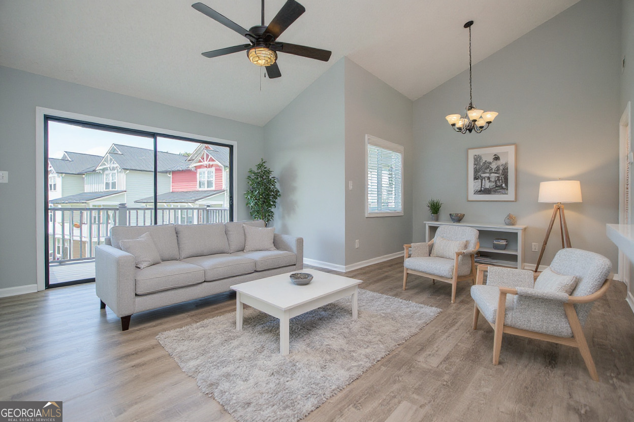 325 Berry Court Villa Rica, GA 30180 - Photo 10 of 43 a living room with furniture a ceiling fan and a window