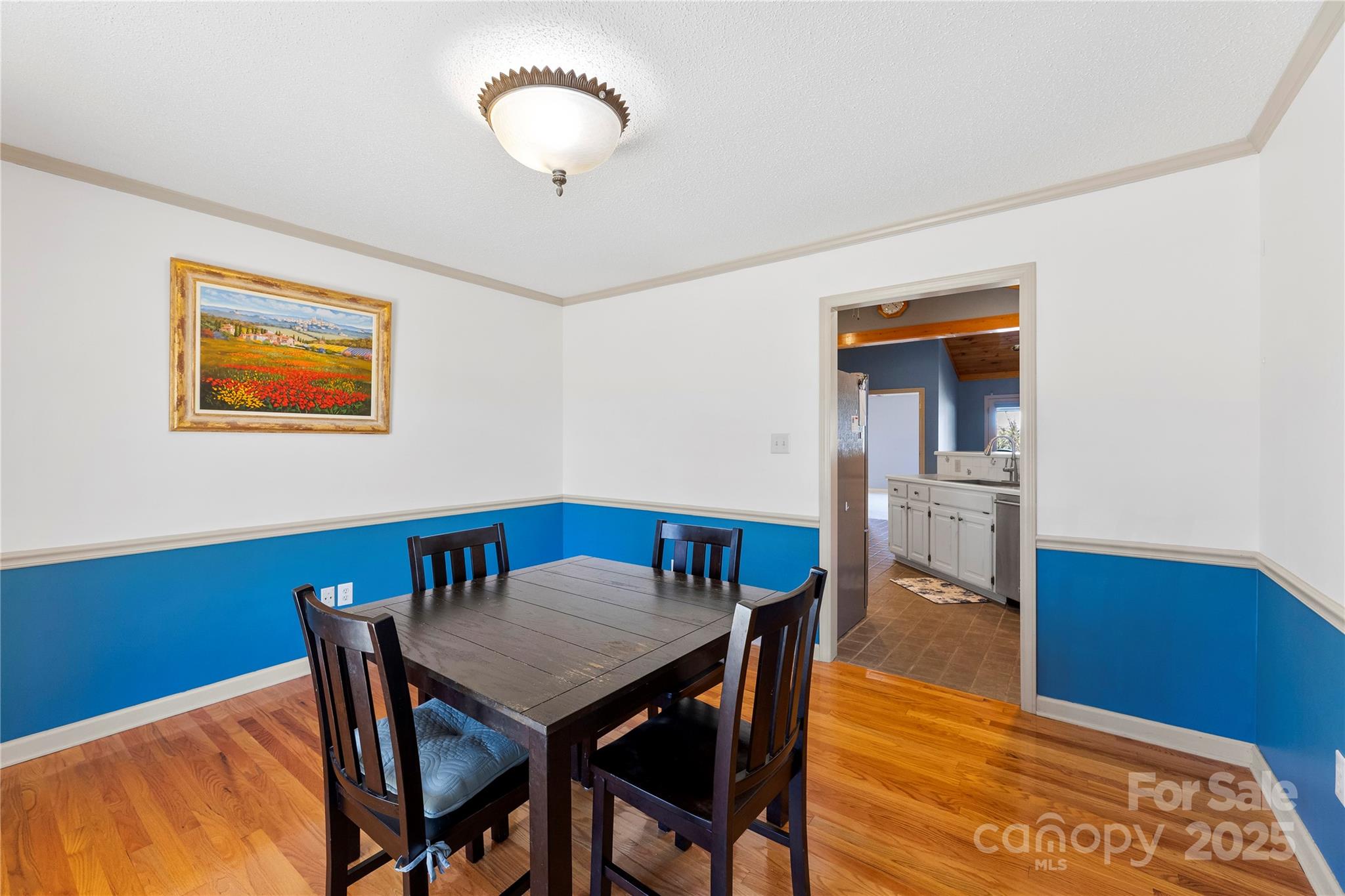 1351 Hardin Road Dallas, NC 28034 - Photo 13 of 39 a view of a dining room with furniture and wooden floor