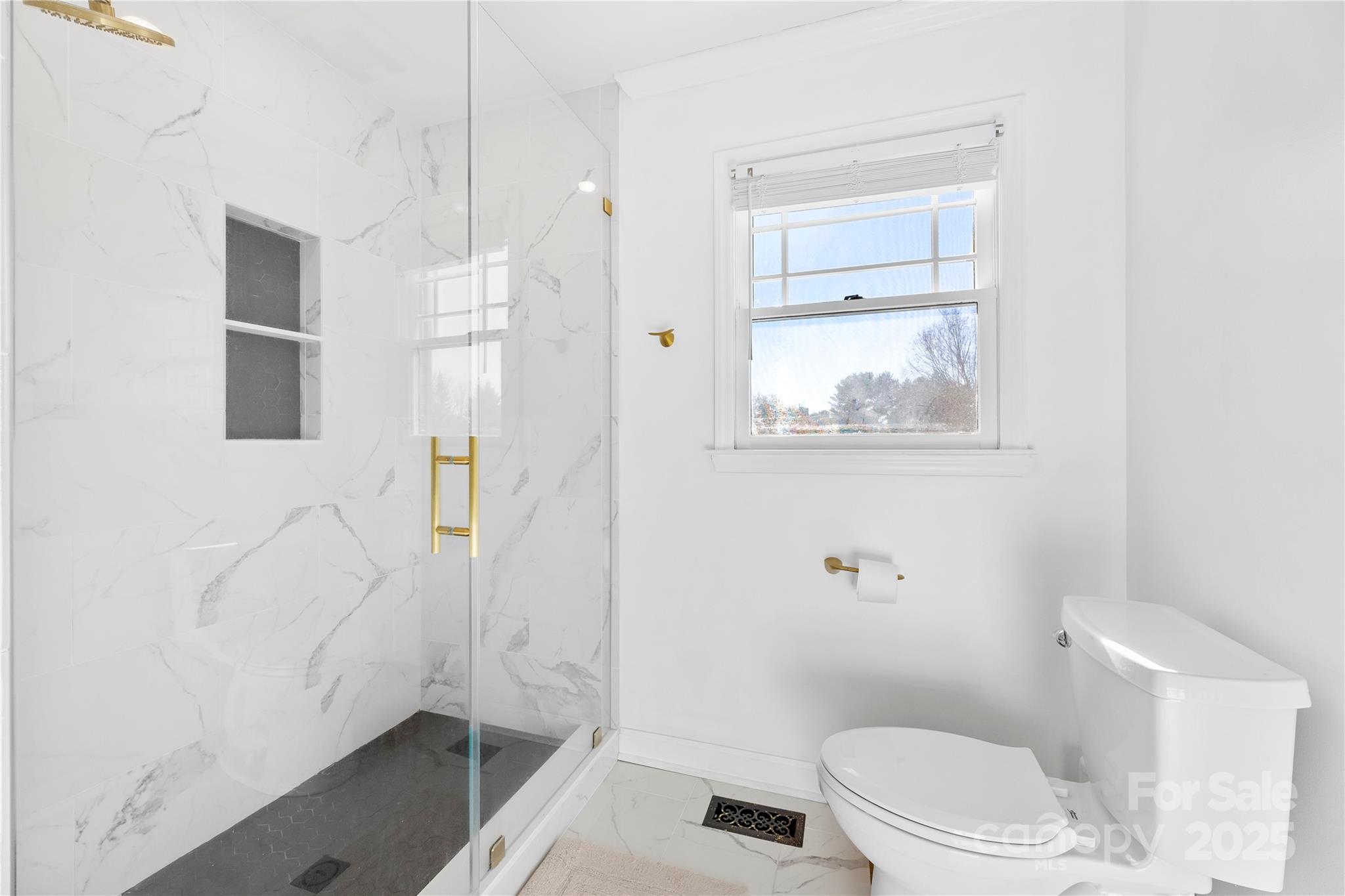 1351 Hardin Road Dallas, NC 28034 - Photo 16 of 39 a bathroom with a toilet a sink and shower