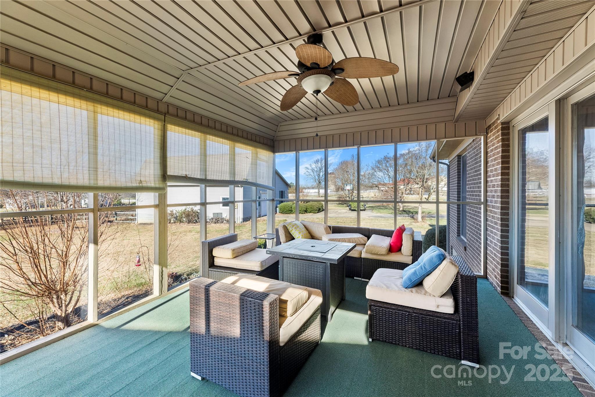 1351 Hardin Road Dallas, NC 28034 - Photo 22 of 39 a living room with furniture a ceiling fan and a large window