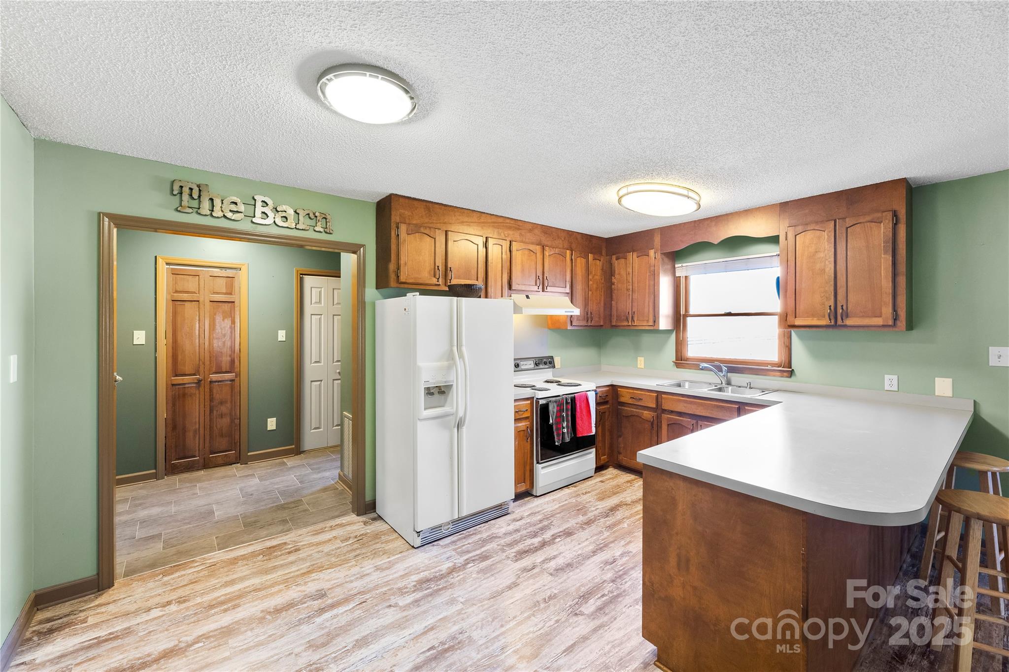 1351 Hardin Road Dallas, NC 28034 - Photo 28 of 39 a kitchen with refrigerator and cabinets