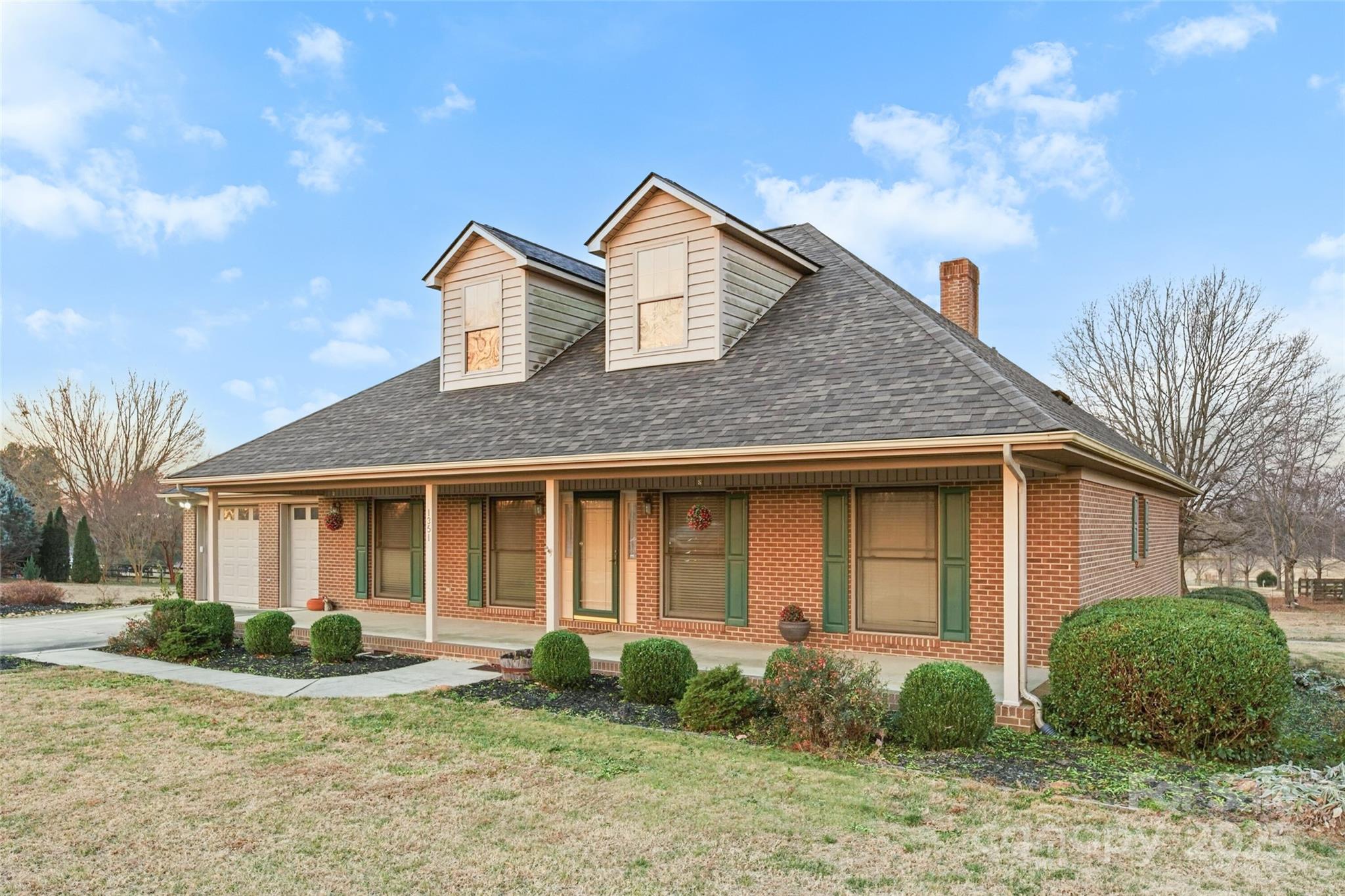 1351 Hardin Road Dallas, NC 28034 - Photo 5 of 39 a view of a house with backyard and garden