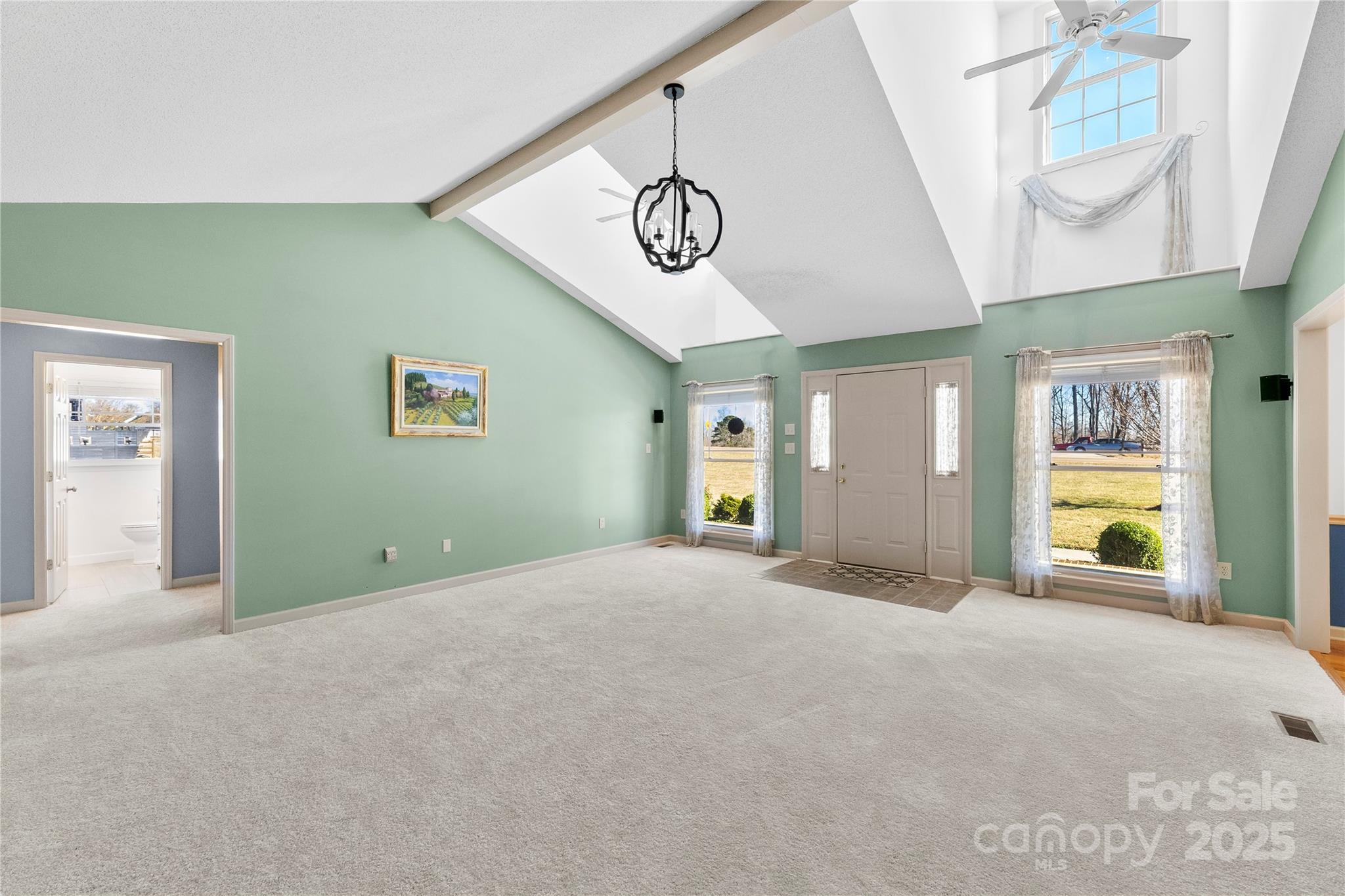 1351 Hardin Road Dallas, NC 28034 - Photo 6 of 39 a view of an empty room with window and wooden floor