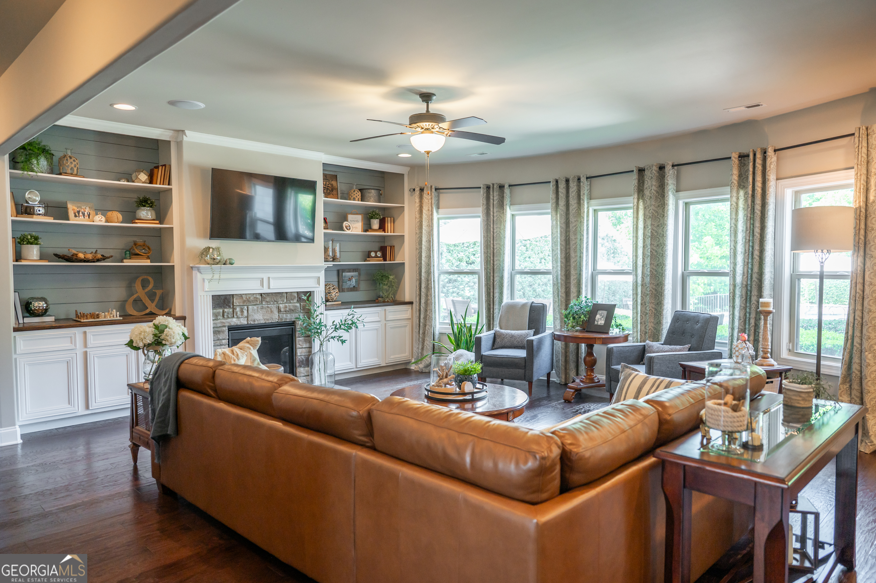 415 EAS Way Fayetteville, GA 30215 - Photo 5 of 70 a living room with furniture a fireplace and a large window